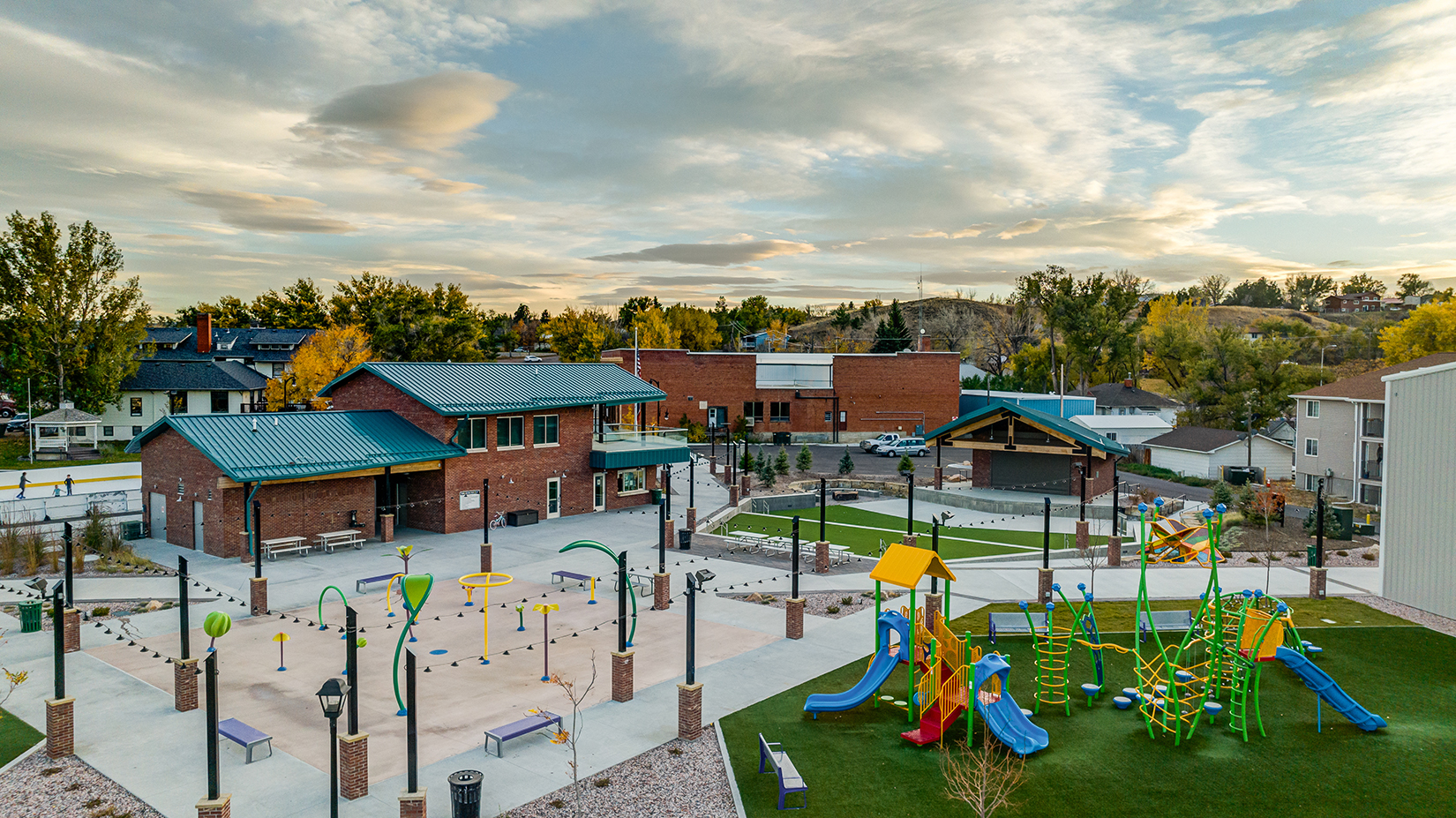 Glenrock Town Square with amphitheater, splash park and playgrounds at sunset